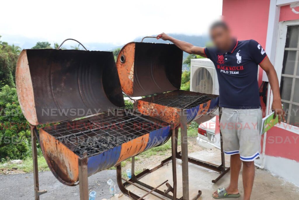CB with a couple of his barbecue pits which he intends to use to start up his food business.  - ROGER JACOB
