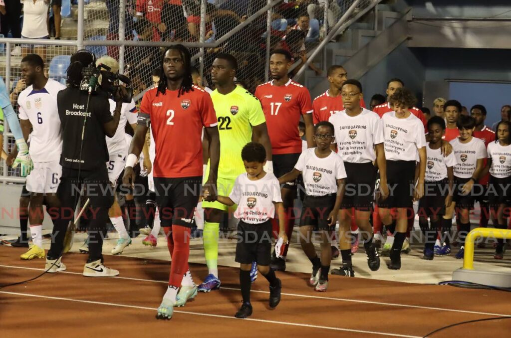 Trinidad and Tobago captain Aubrey David leads his troops on the field for last month's Concacaf Nations League quarterfinal vs USA, at the Hasely Crawford Stadium, Mucurapo. - Photo by Roger Jacob