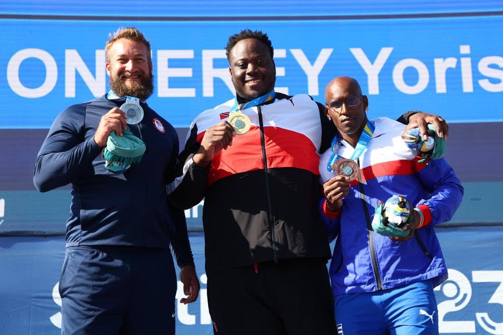 TT's Akeem Stweart (C) shows off his gold medal from the men's F64 discus event at the 2023 Parapan American Games in Chile on November 24. Stewart is flanked by the USA's Ryan Rohn (L) and Cuba's Yorisan Monterey (R).  - Team TTO