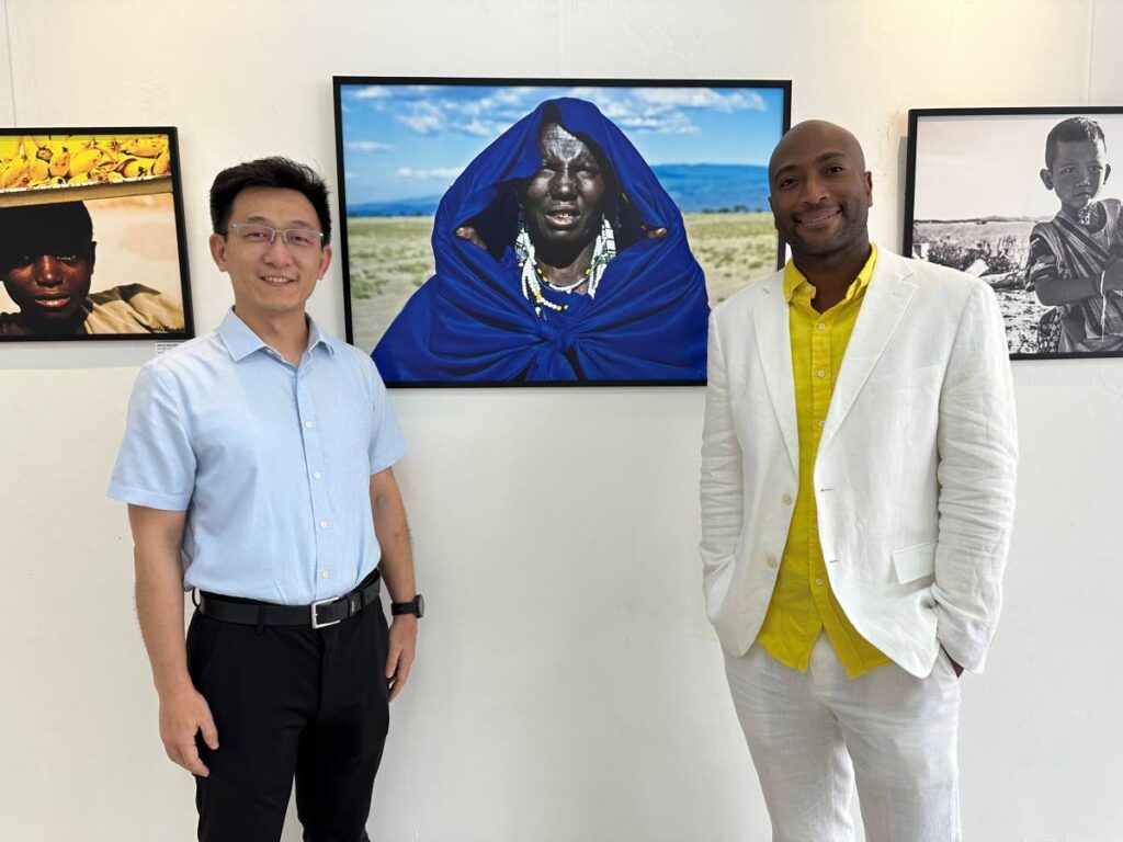 Liu Pengfei, first secretary of the Embassy of the People's Republic of China, with Mandela Gregoire at the Wanderlust exhibition at Arnim’s Art Galleria, Port of Spain. - 