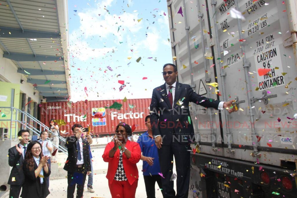 Randall Karim, Permanent Secretary of the Ministry of Trade and Industry closes the container door for the first batch of luggage to be exported to Canada  from Summit Luggage TT company limited at  E TecK’s Phoenix Park Industrial Estate, Point Lisas - 