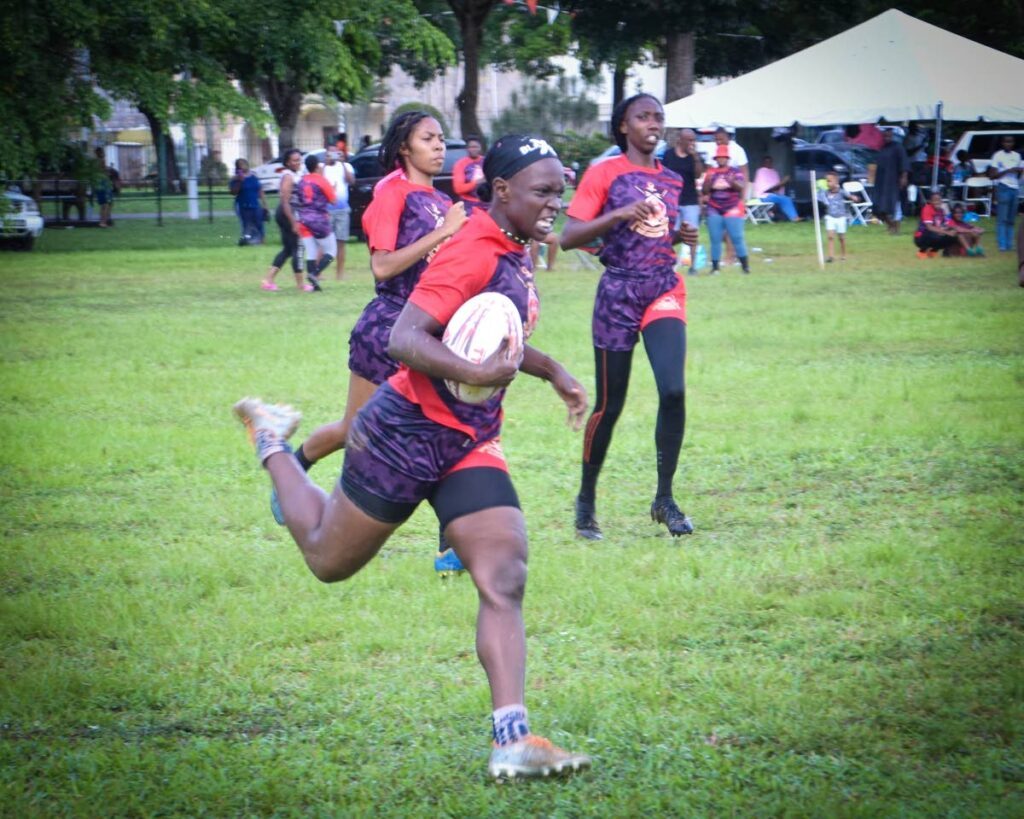 Defence Force women compete recently in the Caribs Rugby Sevens Championships. PHOTO COURTESY DEFENCE FORCE  - 