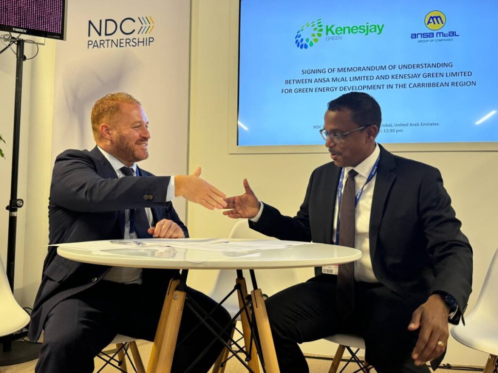 SHAKE ON IT: ANSA McAL Group CEO Anthony N. Sabga III, left, shakes hands with KGL founder and chairman Philip Julien after the signing of an MoU on Saturday during the COP28 conferece in Dubai, United Arab Emirates. PHOTO COURTESY ANSA McAL - ANSA McAL