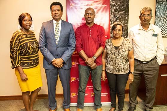 Naphatali Phillip from MIC Foundation, left; Anthony Seeraj, managing director, CIBC First Caribbean Trinidad Operations; Eloy Burge of the Chinapoo Police Youth Club; Lenora Melville of the Laventille Community Children’s Project; and Prof Roger Hosein of the Sure Foundation. - 