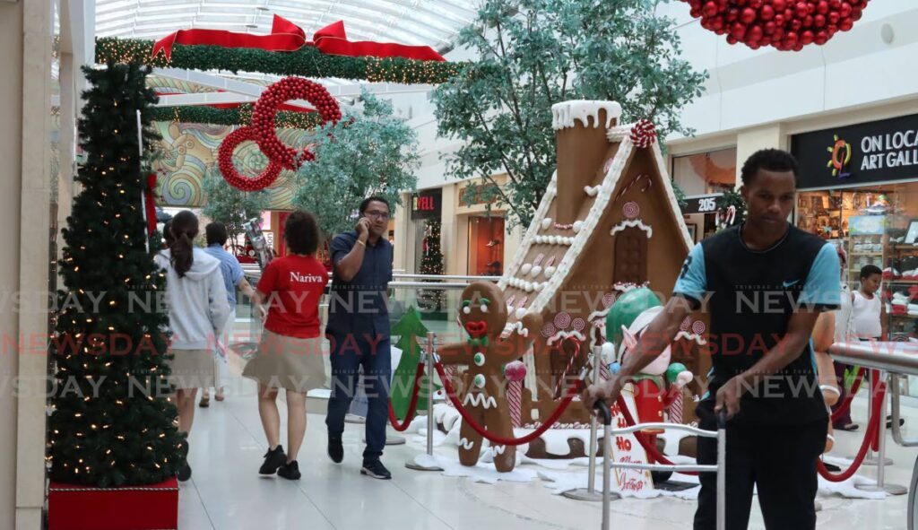 Christmas decor warmly welcomes shoppers at
The Falls West Mall, West Moorings.  - ROGER JACOB