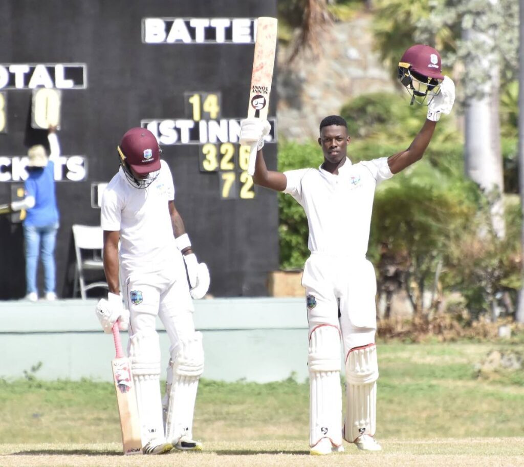 CWI Academy batsman Kevin Wickham raises his bat after scoring a century against Emerging Ireland at Coolidge Cricket Ground, Antigua.  - CWI