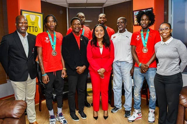 Minister of Sport and Community Development Shamfa Cudjoe-Lewis, middle, during a courtesy call with local basketballers, coaches and sport officials. Head of sport development at SporTT Justin Latapy-George, from left, player Ahkeel Boyd, team manager/physio Wayne Samuel, team captain Moriba DeFreitas, player Chike Augustine, coach Christopher Jackson Charles, player Ahkeem Boyd and sport development officer at SporTT 
Courtnee-Mae Clifford. - courtesy Ministry of Sport and Community Development
