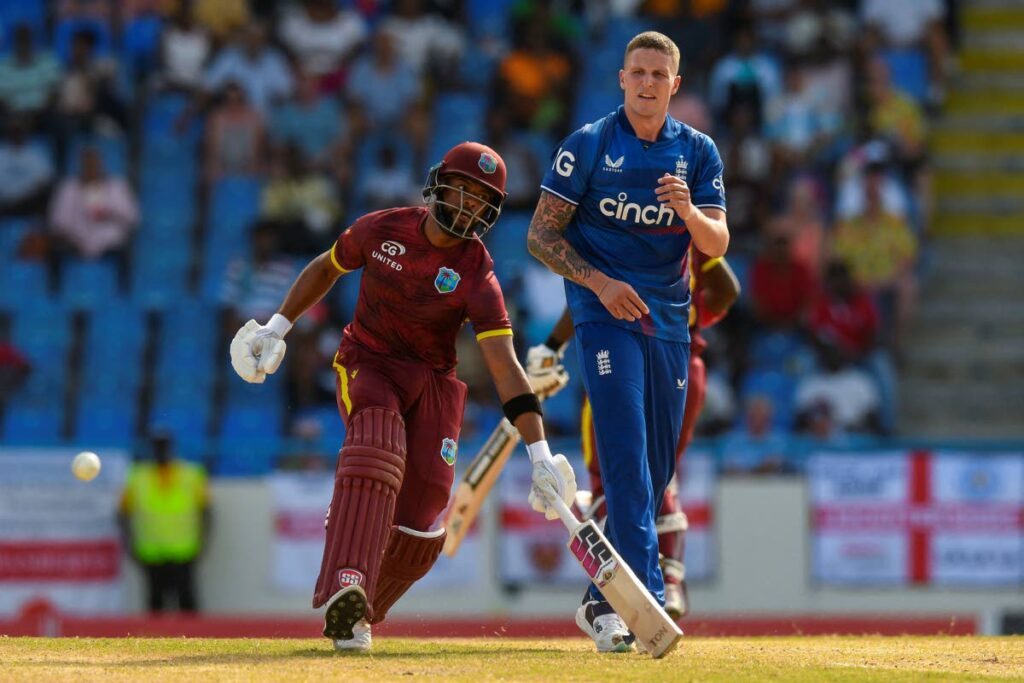 Shai Hope (L) of West Indies gets runs off Brydon Carse (R) of England during the 2nd ODI match  at Sir Vivian Richards Cricket Stadium in North Sound, Antigua and Barbuda, on Wednesday.  - 