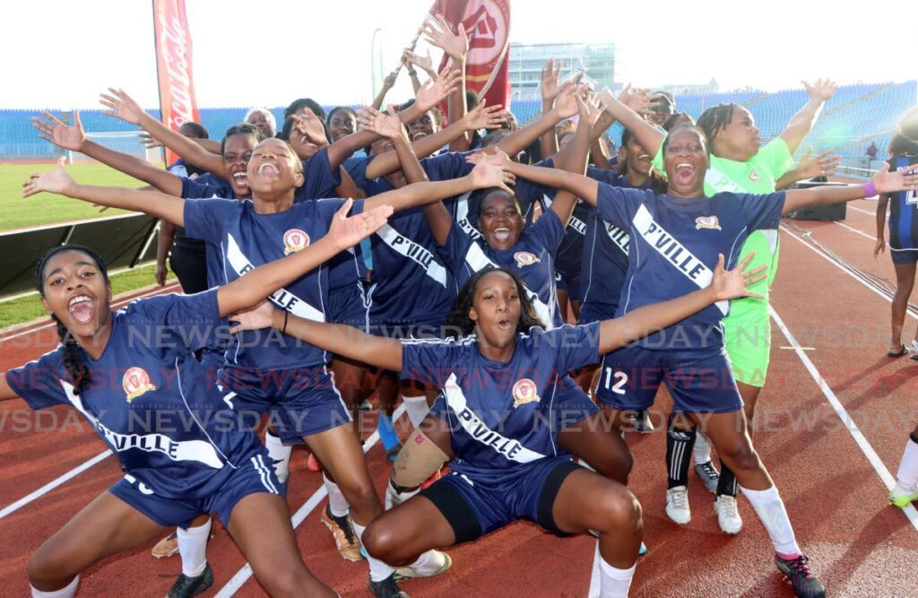 Pleasantville Secondary School celebrate winning the Coca-Cola Girls National Intercol title, at the Hasely Crawford Stadium, Port of Spain last Thursday.  - Angelo Marcelle