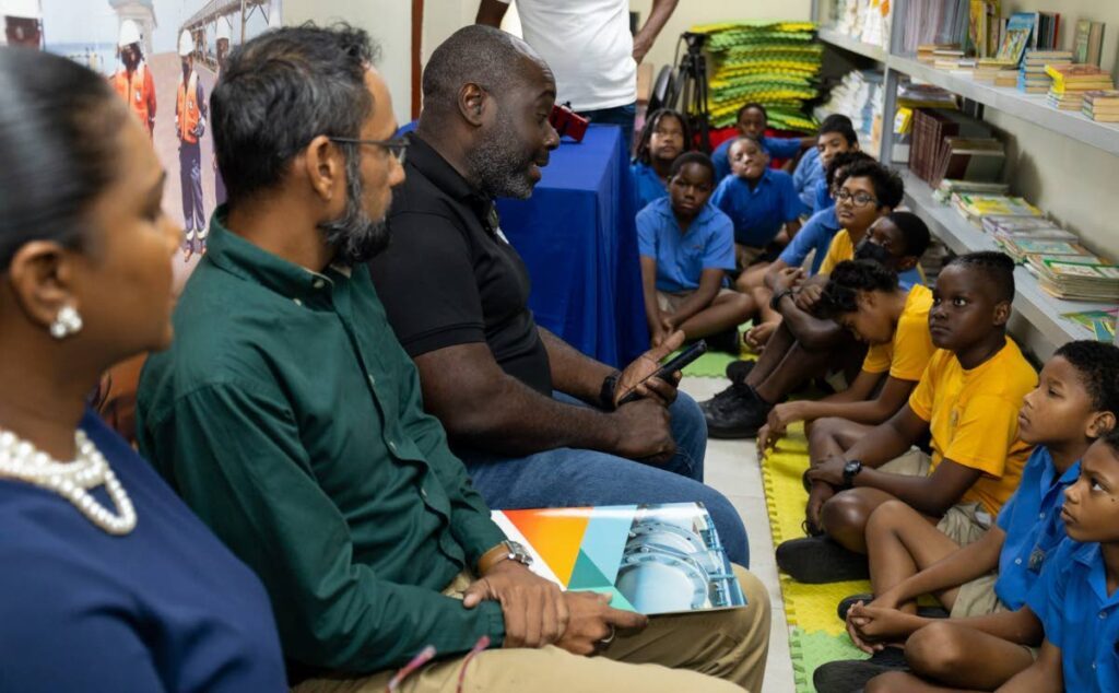 Managing director Pennacool, Phaessuh Kromah (3rd from left) speaks to the students at San Fernando Boys Government Primary School. - 