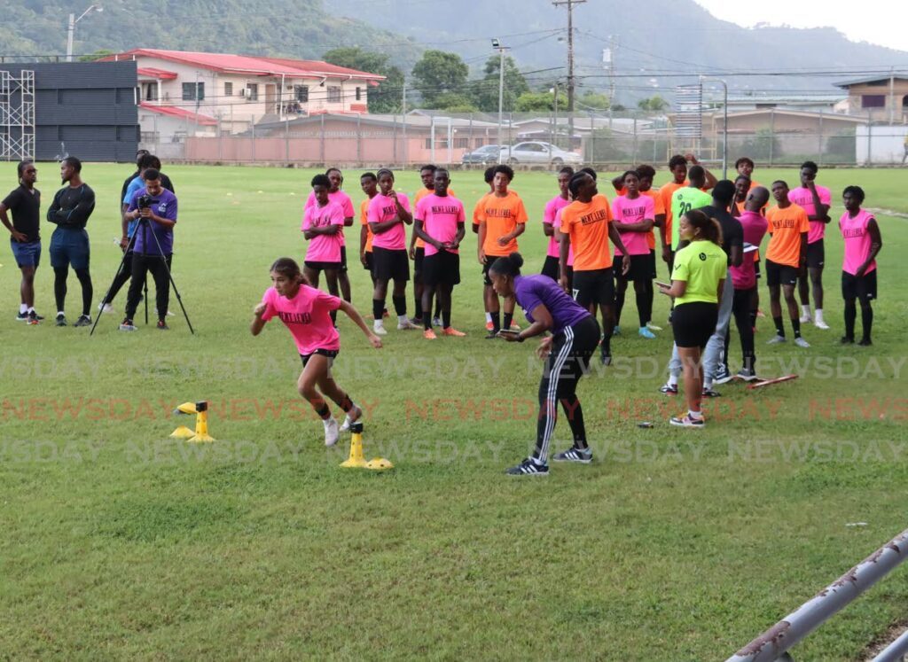 Athletes compete in drills during the Next Level Performance Football Combine at the Diego Martin Sporting Complex, on Monday. - ROGER JACOB