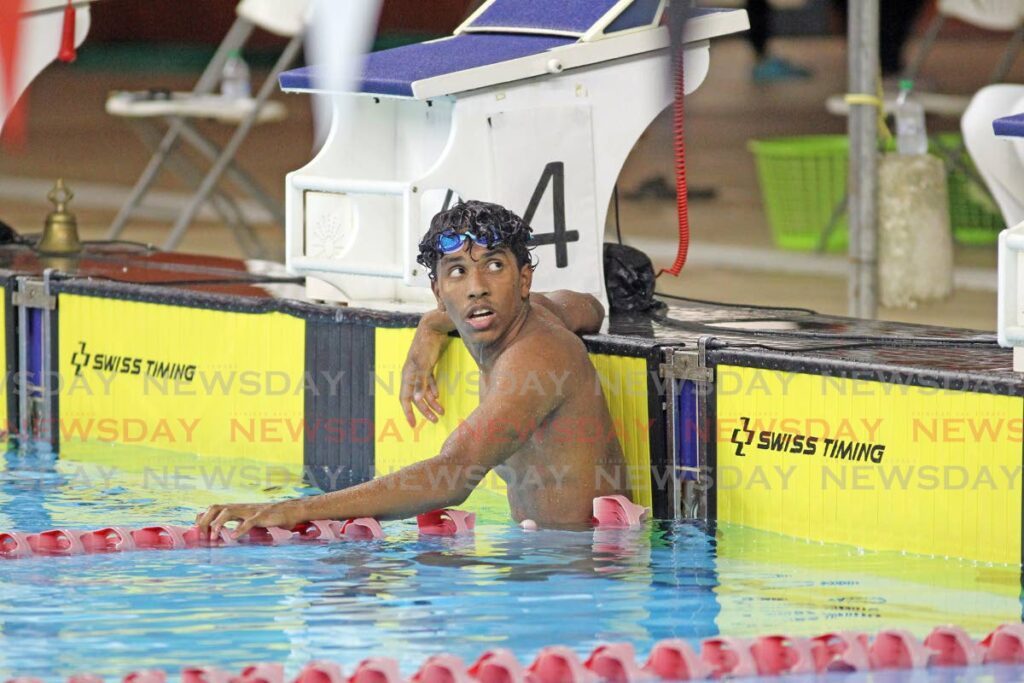 Swimmer Zachary Anthony reacts after competing at the ASATT Inivitational Swimming Championships, at the National Aquatic Centre, Couva, on Wednesday. - Photo by Lincoln Holder