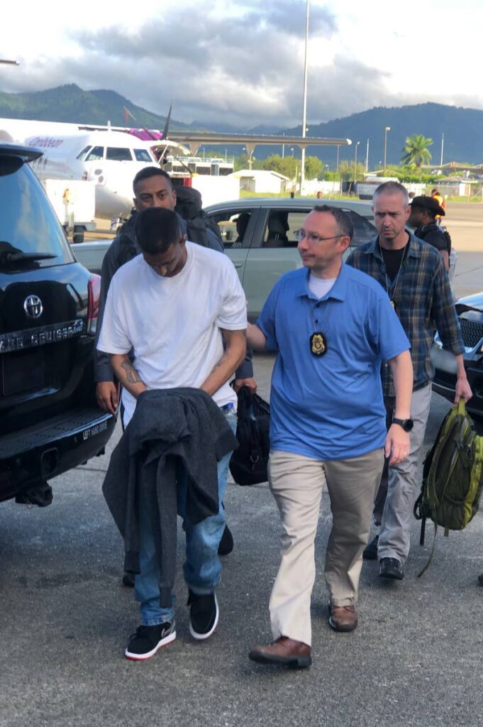 Kim Maharaj being extradited to the US by US Marshals - Photo courtesy United States Embassy 
