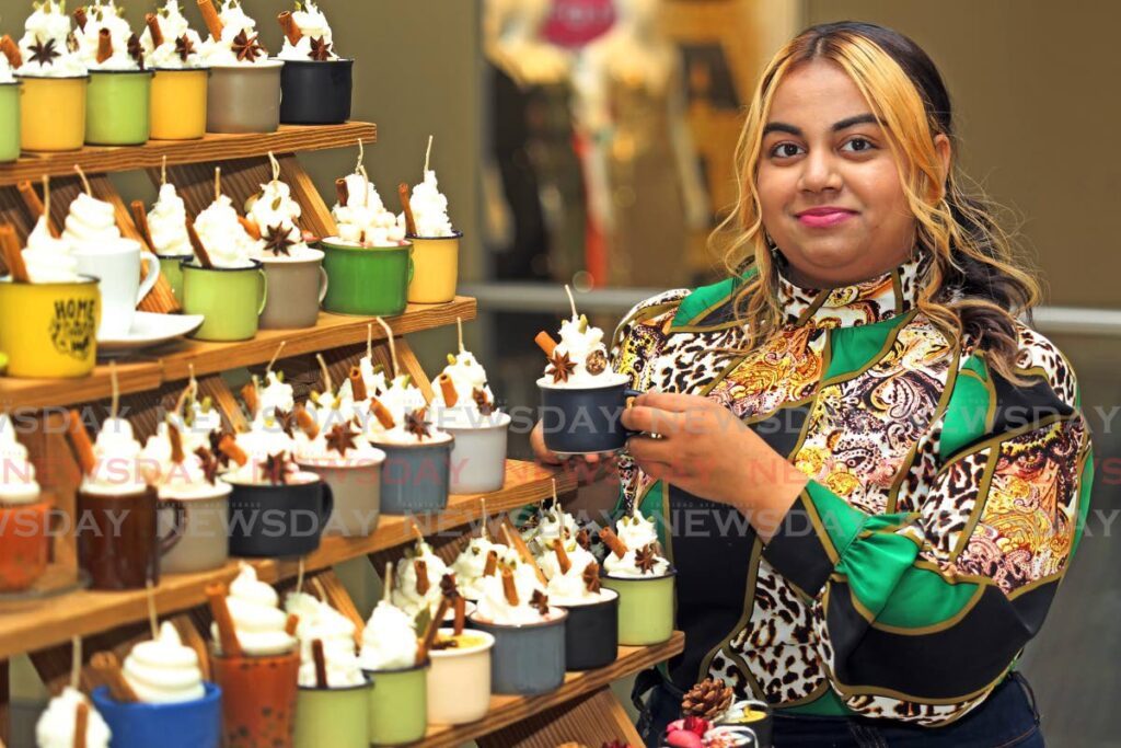 Aneelia Balraj shows off her realistic-looking speciality dessert candles and aromatherapy candles. - 