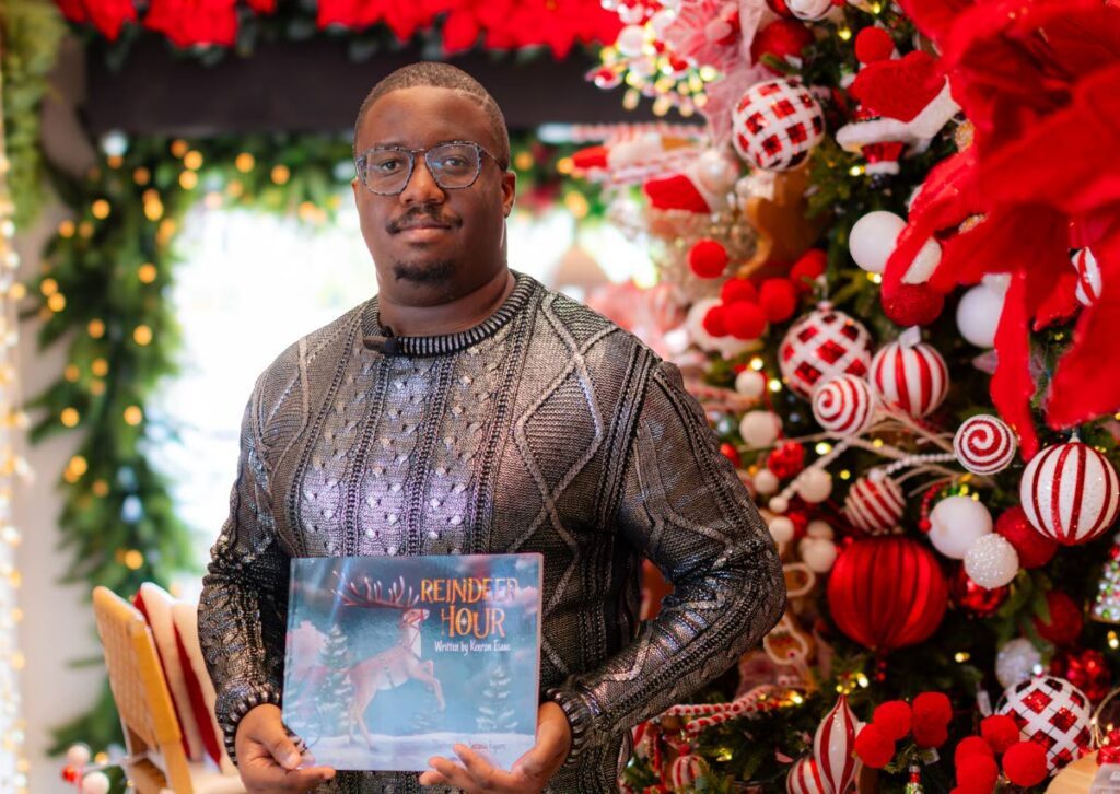 Author  Keeron Isaac with his book Reindeer Hour - 