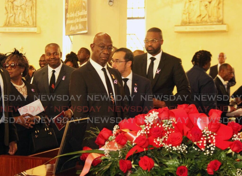 GOODBYE MARLENE: Prime Minister Dr Keith Rowley looks at a photo of former minister Marlene McDonald at her funeral on Friday at the Cathedral of The Immaculate Conception, Independence Square, Port of Spain. - Ayanna Kinsale