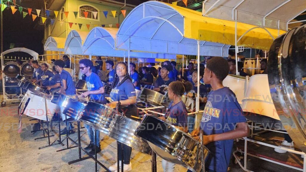 Frontlne players of Fusion Steel Orchestra perfrom at their San Fernando panyard on Friday during preliminary judging of the small conventional steelpan competiton.   - Photo by Yvonne Webb
