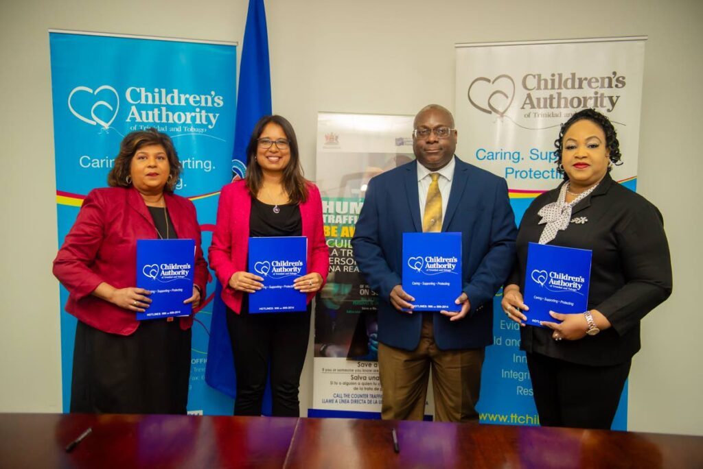 From left: Chief Immigration Officer Vera Persad, Counter Trafficking Unit director Dr Samantha Chaitram, Children’s Authority of TT CEO Sheldon Cyrus, police Special Victims Dept head Supt Claire Guy-Alleyne at the signing of a memorandum of understanding at the launch of the Victims of Trafficking Process Manual on Friday. Photo courtesy Children's Authority - 