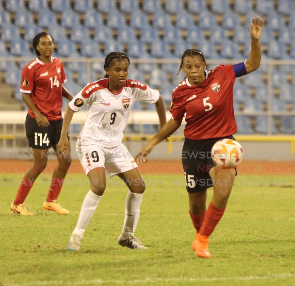 Anastasia O’Brien (R) of Team TT ‘A’ and Team TT B’s Shakilla Hamilton vie for possession during the Jewels of the Caribbean Girls’ Under-17 Inivitational tournament match, on Sunday, at the Hasely Crawford Stadium, Port of Spain. Team A won 6-0. - Photo by Angelo Marcelle