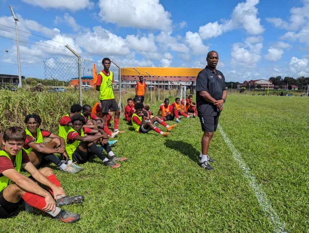 TT men's under-20 football team coach Brian Haynes (R) watches on from the sideline during a screening session for his under-20 charges at the Ato Boldon Stadium training field in Balmain, Couva. - Photo courtesy TTFA Media