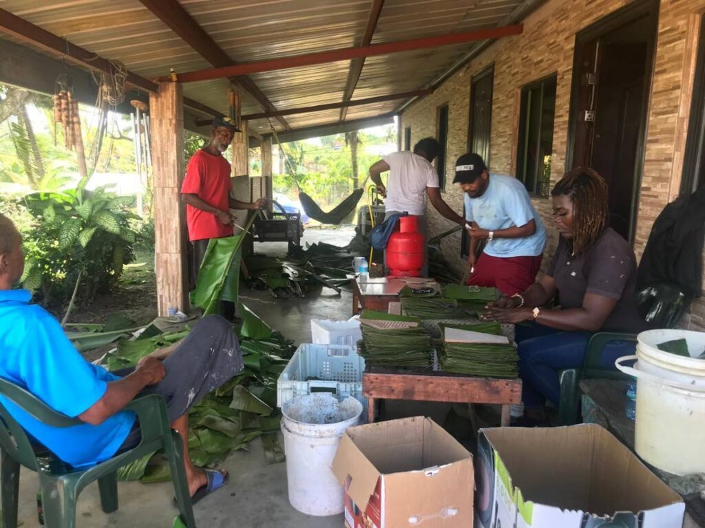 A team of workers clean, sanitise and package banana leaves for Sharon's Pastelle Leaves. - 