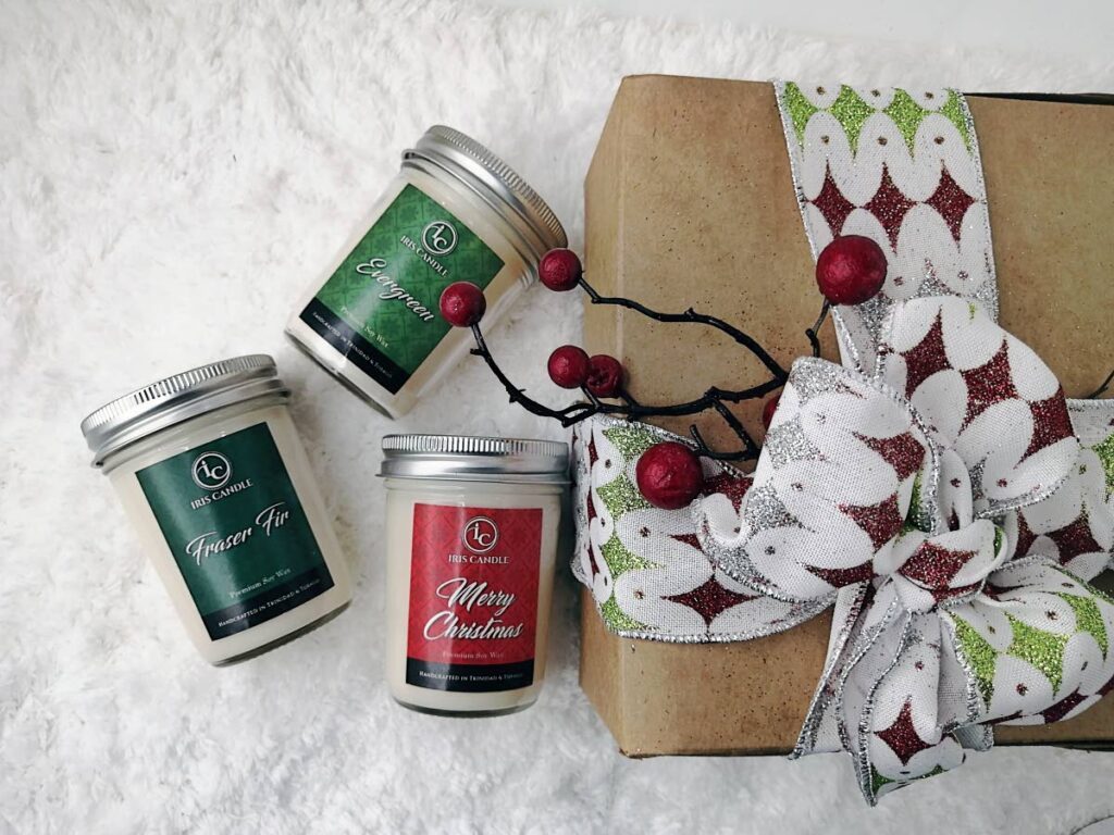Judy Planchart and Sherwin Mungal celebrate the holiday spirit with their Iris Candle scents. - 