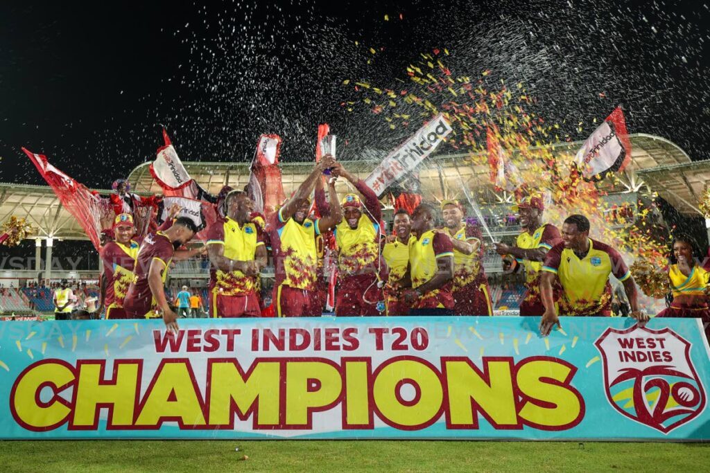 West Indies players celebrate their 3-2 Twenty20 series win over England at the Brian Lara Cricket Academy, on Thursday, in Tarouba. West Indies beat England by four wickets in the fifth and final match.  - Photo by Daniel Prentice