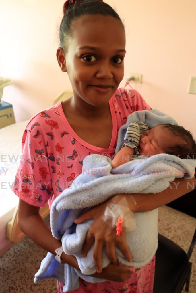 A proud Latoya Hernandez with her Christmas Day baby at the Mt Hope Women's Hospital on Monday. 