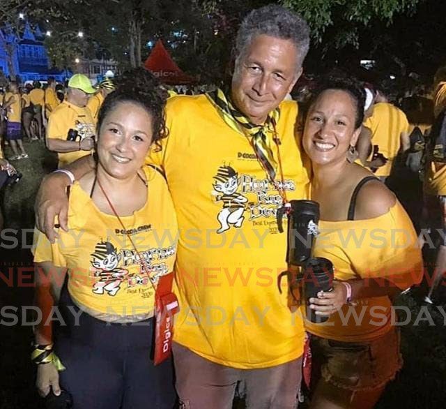 Retired UWI professor Patrick Watson, centre, with his daughters Nikisha, right, and Dr Nadya Watson at a Carnival fete. - 