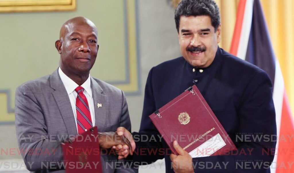 In this August 25, 2018, Prime Minister Dr Keith Rowley shakes hands with Venezuelan President Nicolas Maduro after signing a memorandum of understanding for the Dragon natural gas field. On Friday, the Prime Minister announced Trinidad and Tobago and Venezuela signed a formal agreement for exploration. - 