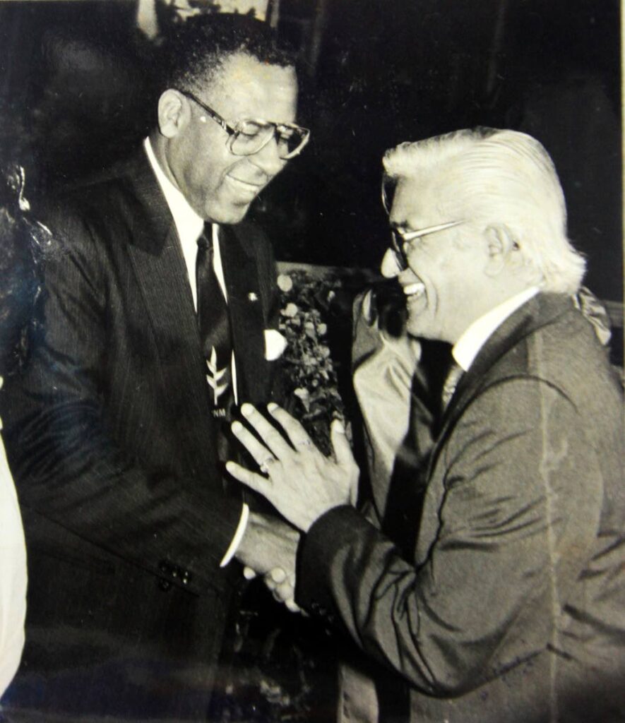 In this March 19, 1992 file photo, prime minister Patrick Manning greets opposition leader Basdeo Panday at the swearing-in ceremony of Manning at President's House.  - File photo courtesy T&T News Centre Ltd
