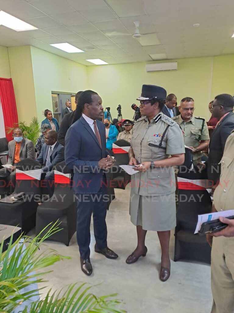 National Security Minister Fitzgerald Hinds speaks with Police Commissioner Erla Harewood-Christopher at an event last year. - File photo