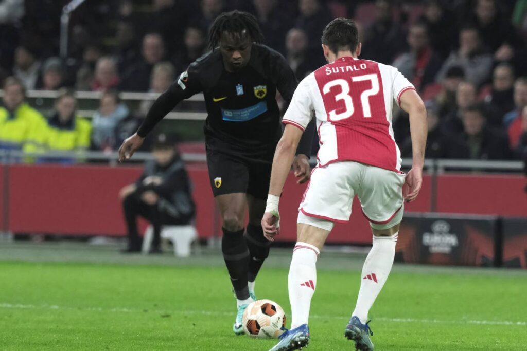 AEK's Levi Garcia (L), and Ajax's Josip Sutalo challenge for the ball during the Europa League group B match at the Johan Cruyff ArenA stadium in Amsterdam, Netherlands, on December 14, 2023. - AP PHOTO