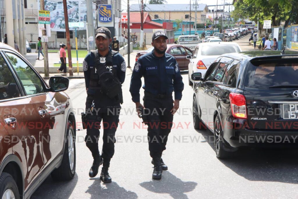 Police officers on patrol in Arima. - File photo by Angelo Marcelle