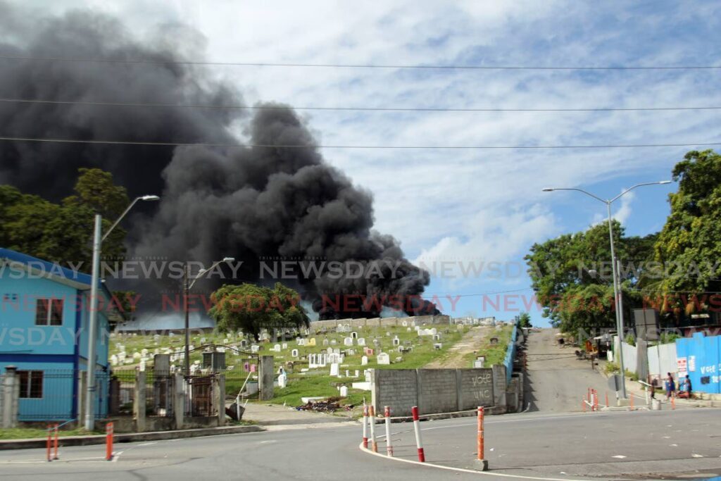 Heavy smoke billows out of a fire at a landfill on Lady Hailes Avenue, San Fernando, on Monday. - Lincoln Holder 