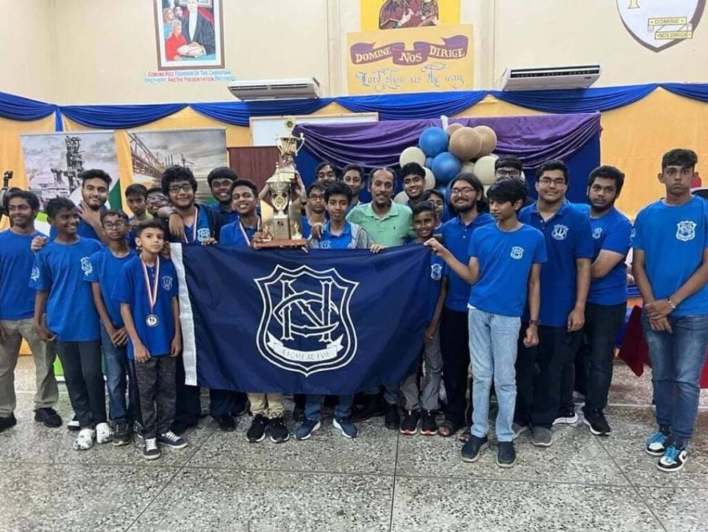 Naparima College’s chess team celebrate their victory at the 2023 National Secondary School Chess Tournament. Photo courtesy Naparima College - Naparima College 