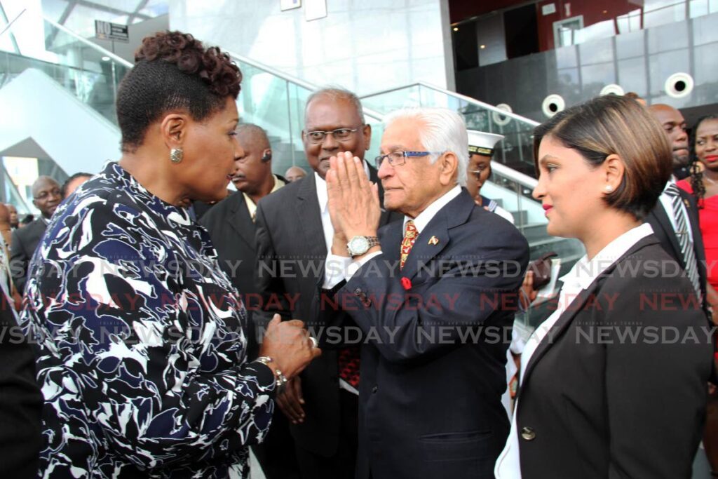 Former prime minister Basdeo Panday, alongside his daughter Mickela, greets former president Paula-Mae Weekes during a reception at NAPA, Port of Spain on March 18, 2019. - 
