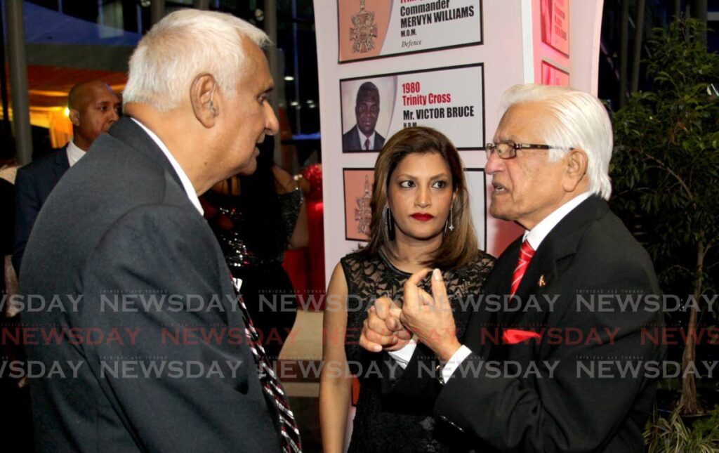 Former NAR and UNC government minister Winston Dookeran, left, Mickela Panday and her father, former prime minister, the late Basdeo Panday at the national awards ceremony, NAPA on September 25, 2019. - File photo by Roger Jacob