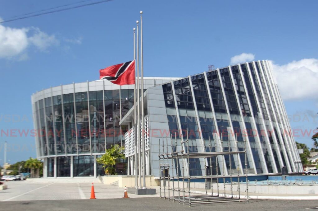 The national flag flying at half-mast outside the Southern Academy for the Performing Arts where the funeral service of former prime minister the late Basdeo Panday will be held on January 9. - Photo by Lincoln Holder