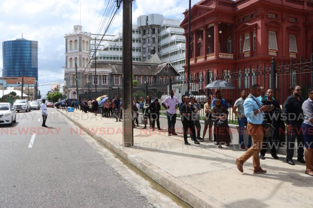 Members of the  public line up outside the Red House, Port of Spain, to pay their last respects to former prime minister Basdeo Panday on Friday.  - Photo by Angelo Marcelle