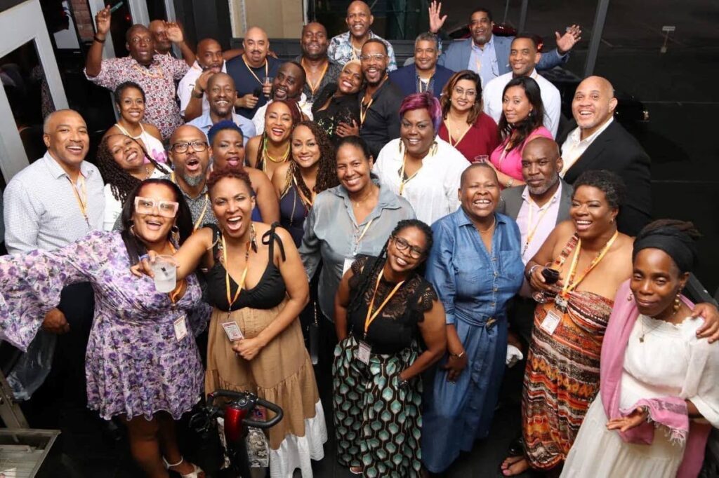 Stacey Samuel-O'Brien, front centre, takes a toast with Polytechnic classmates at their 30-year reunion in May, 2023. - 