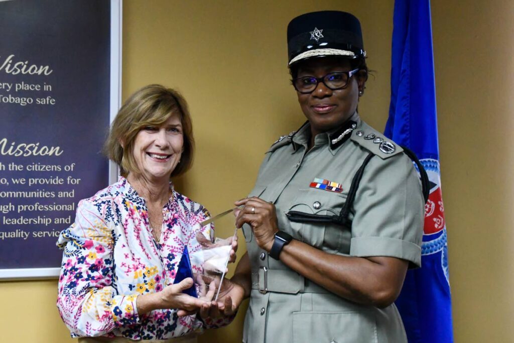 President of Arrive Alive Sharon Inglefield presents Commissioner of Police Erla Harewood-Christopher with the road safety award - Photo courtesy the TTPS