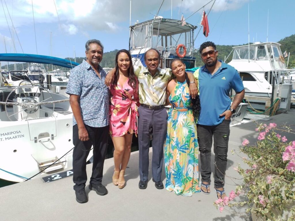 Writer and executive 
producer Horace Wilson, centre, hugs actresses Teri-Leigh Bovell, second from left, and Ruby Parris who will be appearing in a new film based on the soap opera No Boundaries. At left is executive producer, director and actor Marvin Ishmael, and at right is his son 
and fellow actor Mark. 
 - Julien Neaves
