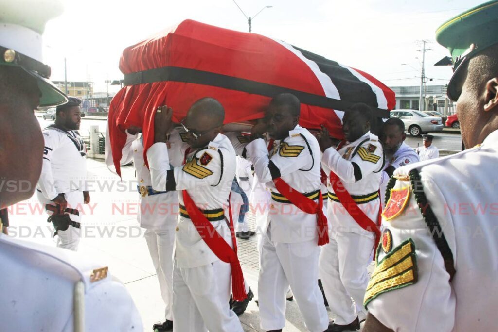 Members of the Defence Force carry the body of former prime minister the late Basdeo Panday to the Southern Academy for the Performing Arts, San Fernando where it lay in state on January 8. - Lincoln Holder 