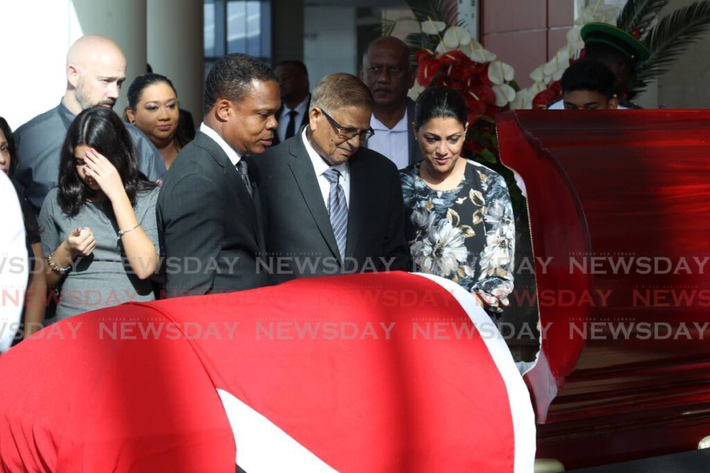 Minister of Foreign Affairs Dr Amery Browne, left, with Subhas Panday and Mickela Panday at SAPA, San Fernando where the body of late Prime Minister Basdeo Panday lay in state on Monday. - Photo by Lincoln Holder 