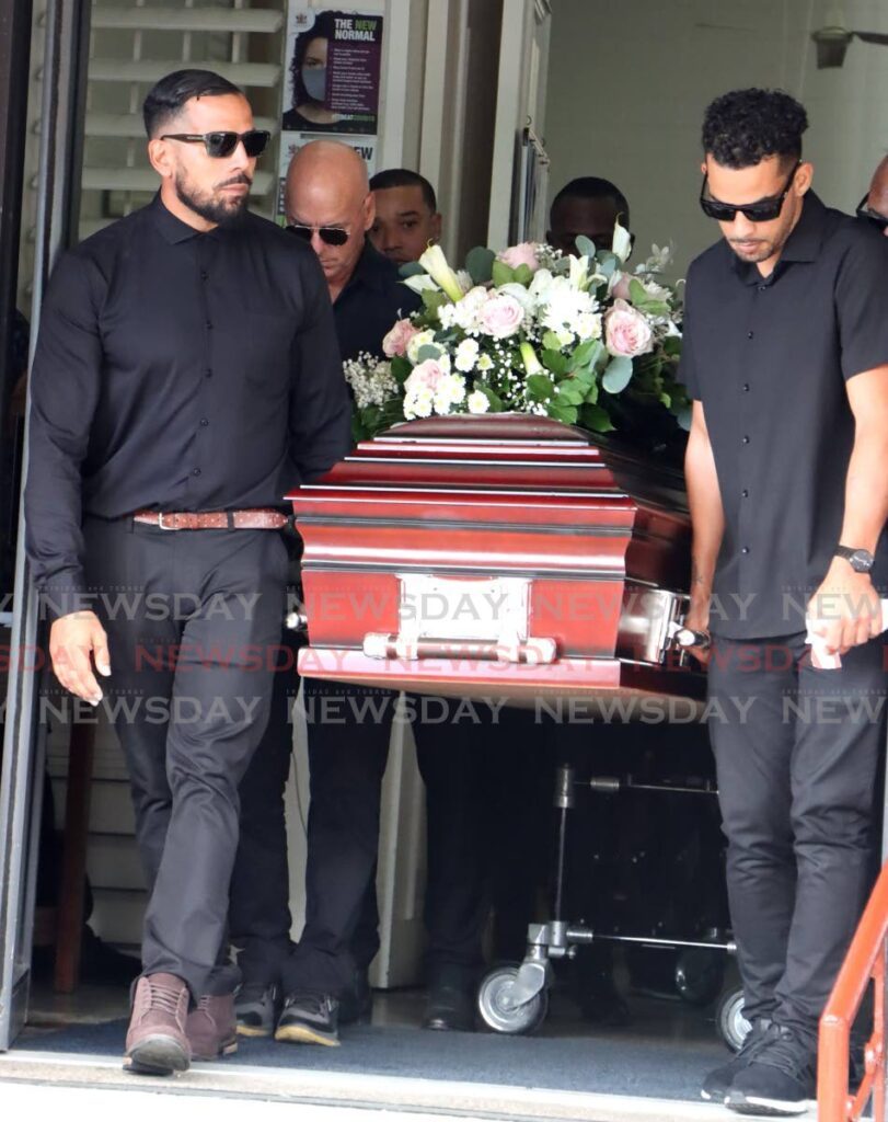 Caskets bearing the bodies of Carmelita Deleon and Calida Schamber are loaded into hearses at the Church of Nativity, Crystal Stream in Diego Martin Tuesday January 9, 2024. - Photo by Faith Ayoung
