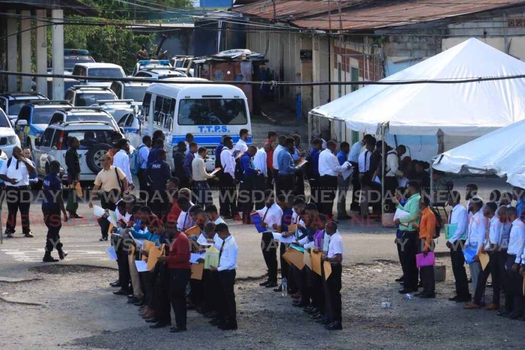 Some of the thousands who lined up in both north and south Trinidad for police recruitment on Friday. PHOTO BY ROGER JACOB - ROGER JACOB