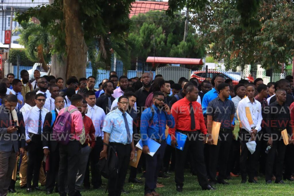 Hundreds of men presented themselves at the Police Training Academy in St James seeking careers in the police service on Friday morning, as the first day of the male police officer recruitment drive commenced. - Photo by Roger Jacob