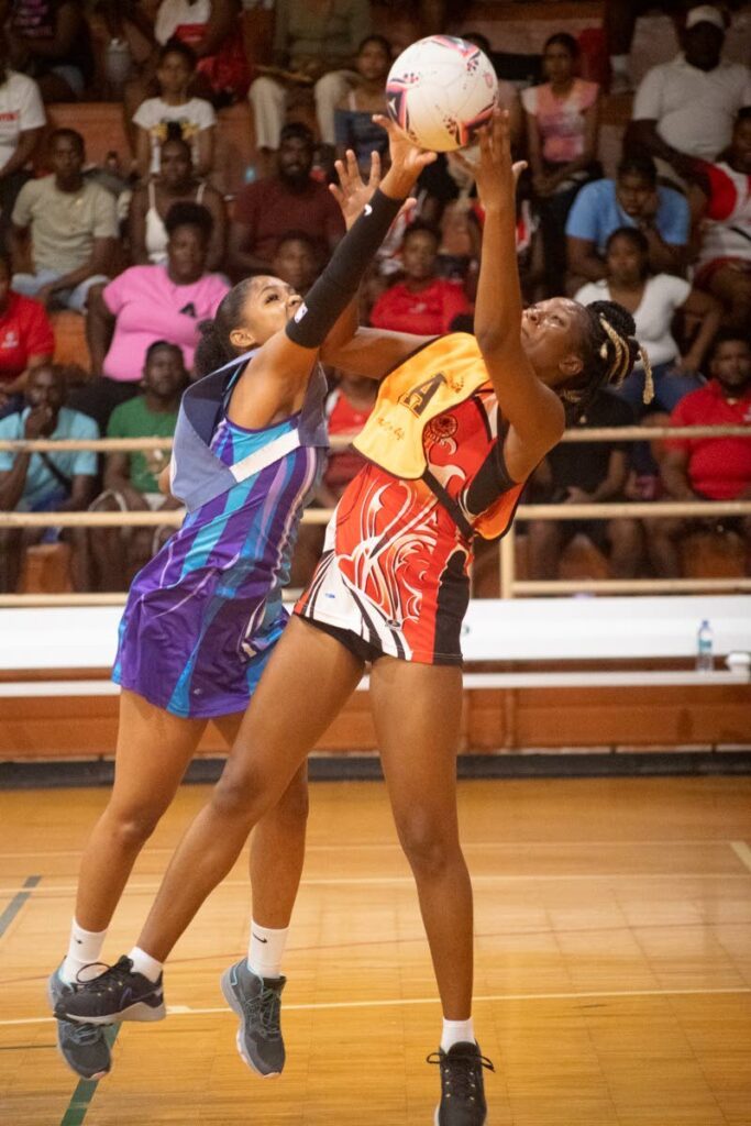 Former Calypso Girl Kalifa McCollin-Lopez (UTT Patriots), right, battles national Under-21 candidate Jelissa Goodridge (Police NYC) at the Courts All Sectors Netball League opening day KO action, at the Eastern Regional Indoor Arena, Tacarigua.  - Dennis Allen for @TTGameplan