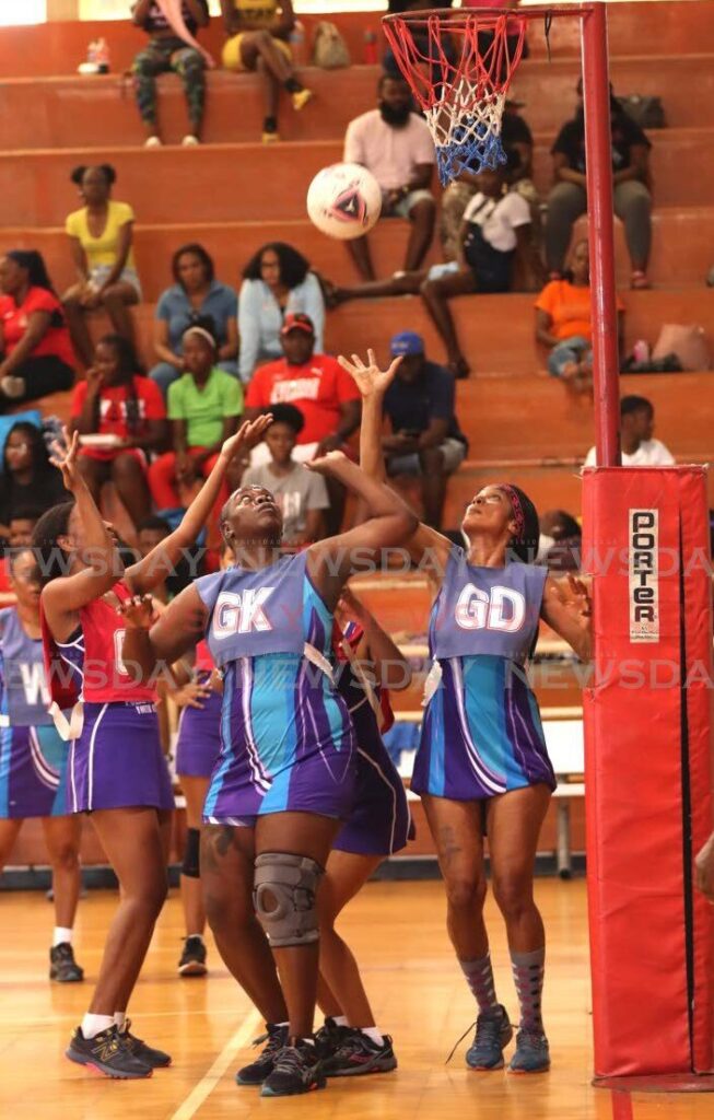 Police team defend their net against the Police Netball Youth Club in the Championship Division last weekend in the Courts All Sectors Netball League, at the Eastern Regional Indoor Sports Arena, Tacarigua. - Photo by Faith Ayoung